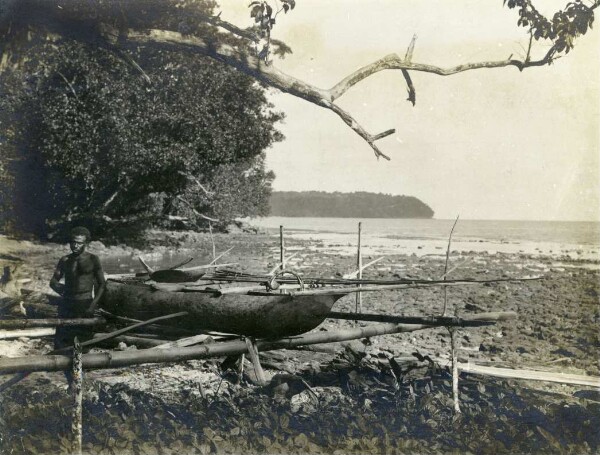 "Dugout canoe with fishing spears and shark fishing gear"