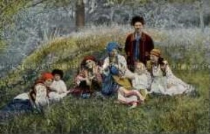 Familie in ukrainischer Volkstracht auf der Wiese