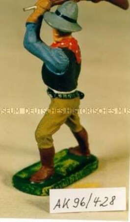 Cowboy, mit Gewehr schlagend