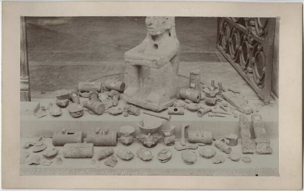 Stone idol and smaller objects.