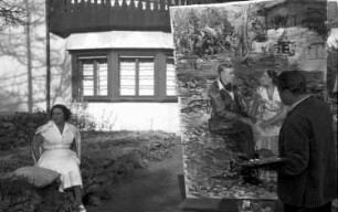 St. Moritz: Prinzenpaar wird gemalt (Hintergrund Haus), Maler und Staffelei; näher