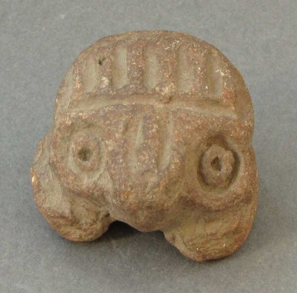 Clay vessel (clay head, fragment)