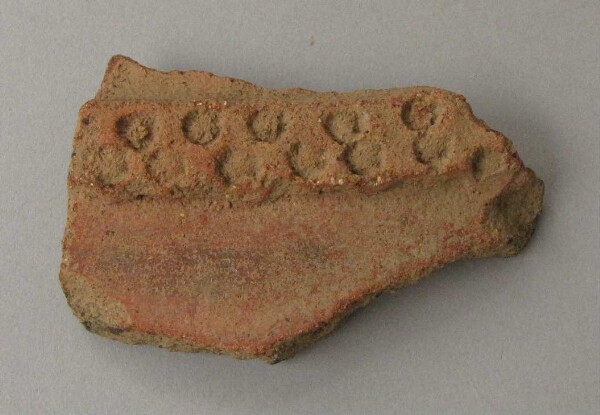 Rim sherd of a clay vessel