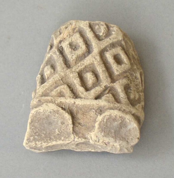 Lower part of a clay figure