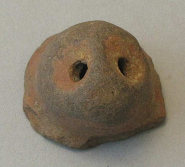 Clay head of an animal figure