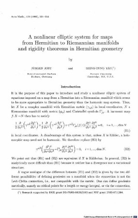 A nonlinear elliptic system for maps from Hermitian to Riemannian manifolds and rigidity theorems in Hermitian geometry
