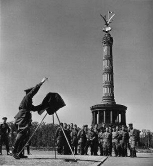 To send their folks back home, Russian soldiers pose for pictures of themselves and Berlin's Siegessäule Victory Monument