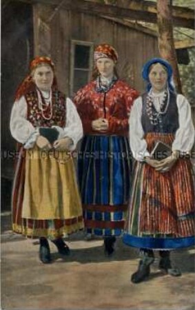 Mädchen in polnischer Volkstracht mit Bibeln