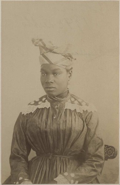 Photograph of a woman, headdress in Port au Prince