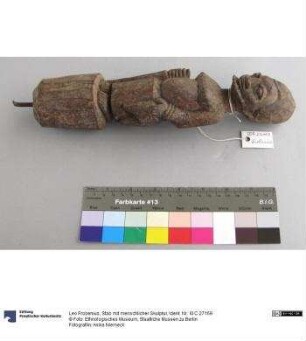 Stab mit menschlicher Skulptur