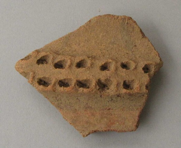 Clay shard of a vessel