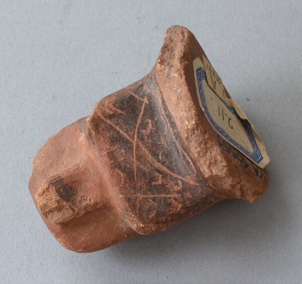 Clay animal head (vessel fragment)