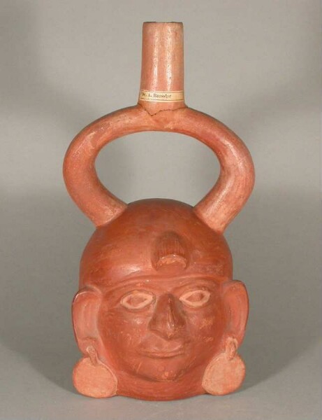 Figure vessel with stirrup spout