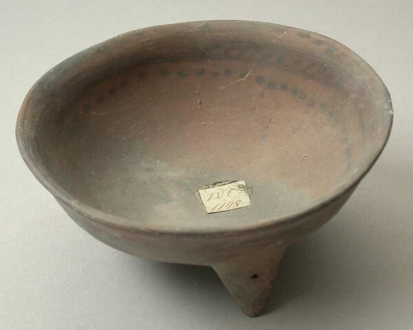 Three-footed clay bowl