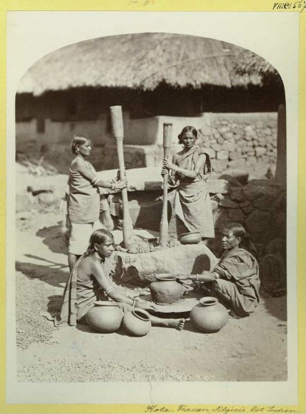 Kota women pounding pottery clay