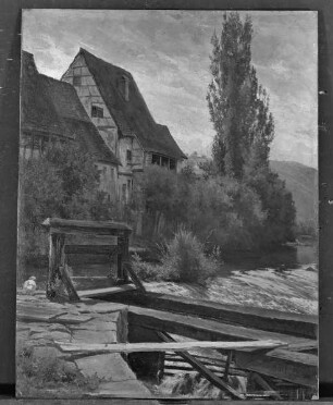 Fachwerkhäuser am Flußufer beim Wehr