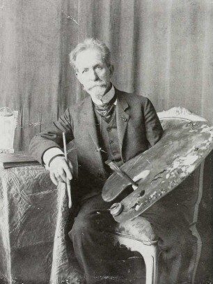 Der Maler Ermenegildo Antonio Donadini mit Palette in seinem Atelier