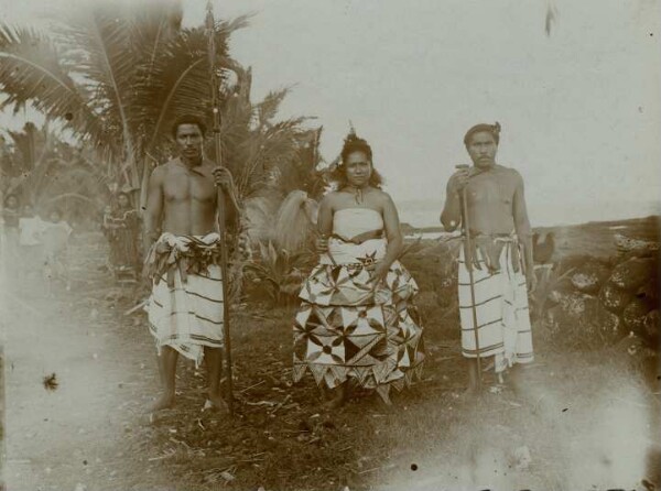 "Left man with skilfully carved spear. Woman with bark cloth, a. Man with long staff, Samoa."