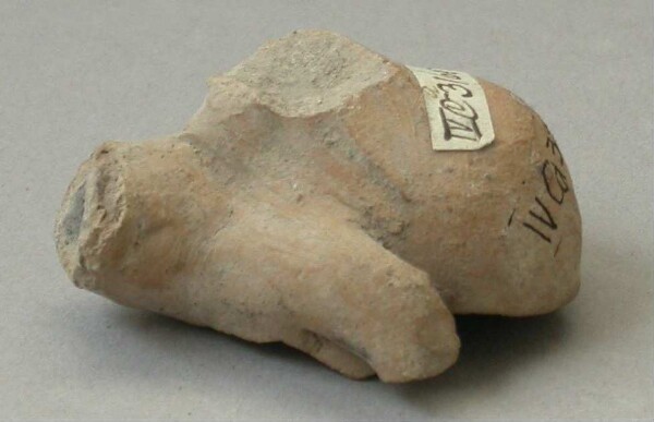 Fragment of a clay rattle (torso of a clay figure)