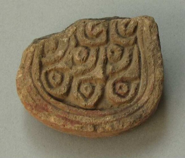 Handle of a clay vessel (fragment)