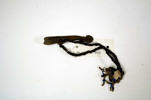 Signal whistle with amulet cord