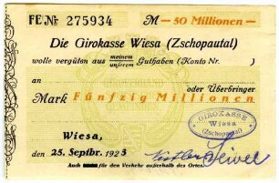 Scheck über Fünfzig Millionen Mark