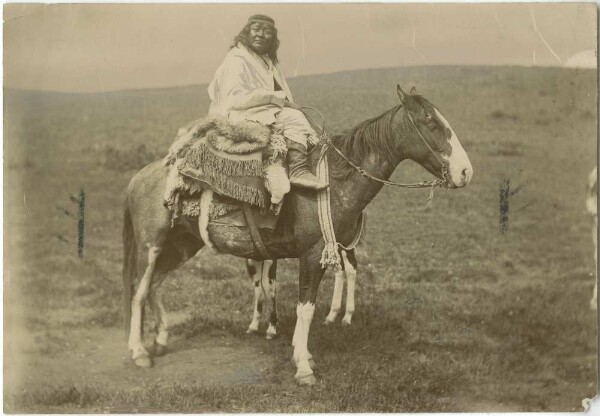 Tehuelchen woman on horseback