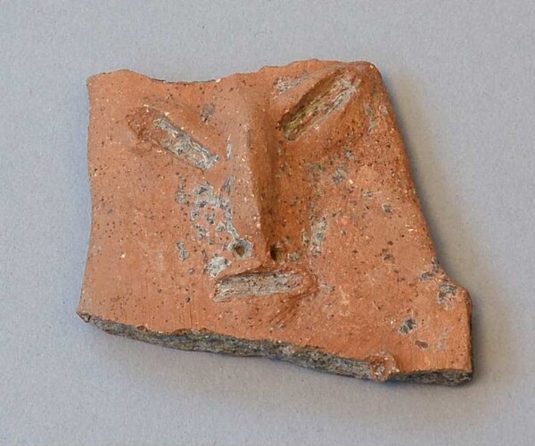 Fragment of a relief figure