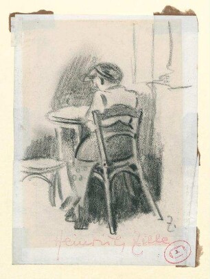 Am Tisch sitzende Person in Rückenansicht