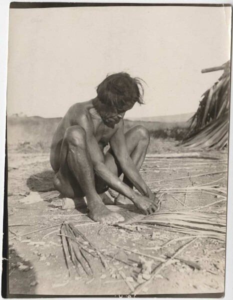 Arekuna Indian weaves a frond