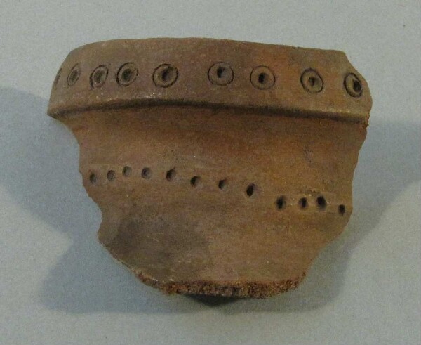 Fragment of a clay vessel