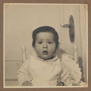 Christiane Zimmers Sohn Andreas im Kinderstuhl sitzend