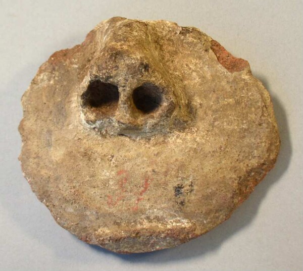 Clay fragment of a face