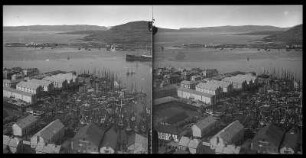 Hammerfest. Segelschiffhafen. Blick auf Hafengebäude und Segelschiffe gegen Bucht und Bergkette