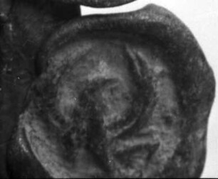 Plombe mit konischem Zapfen, sog. Handelsblei, in Relief ein Vogel (?)