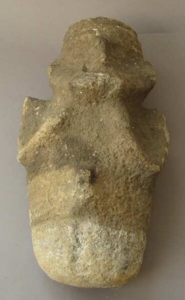 Seated male figure with erect penis