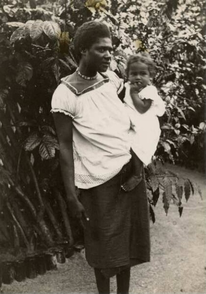 "Marikan, girl from Nusa with child in her arms"