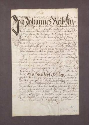 Verkaufsbrief des Joh. Reiß zu Haueneberstein gegen Hans Hartweck über eine halbe Behausung, Scheuer und Holzplatz zwischen Mathäus Dietrich und der Almende um 100 fl.