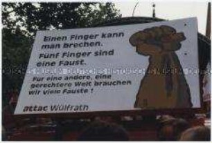 Transparent vom Attac-Aktionstag in Köln 2002 "Einen Finger kann man brechen..."