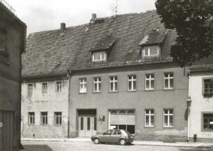 Belgern, Topfmarkt 4. Wohnhaus (19. Jh.) mit Laden (um 1925)