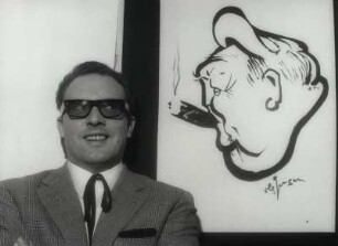 [Achim Strietzel mit Karikatur von Ludwig Erhard]