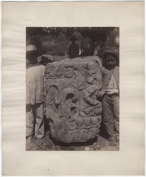 Altar U, south side. Local boys standing beside and behind it.