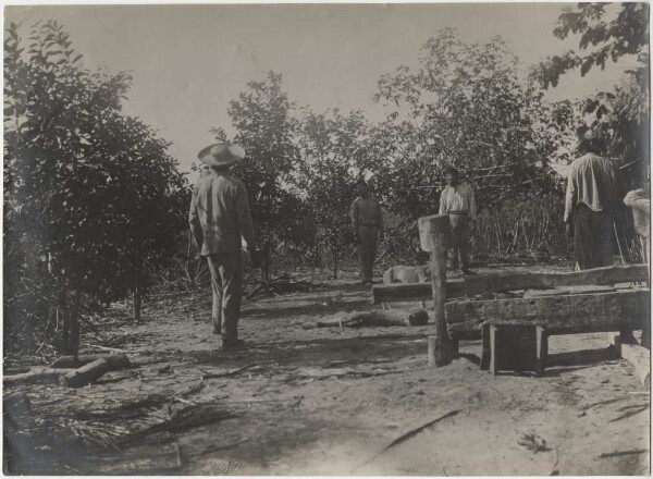 Guato playing badminton in a Brazilian settlement