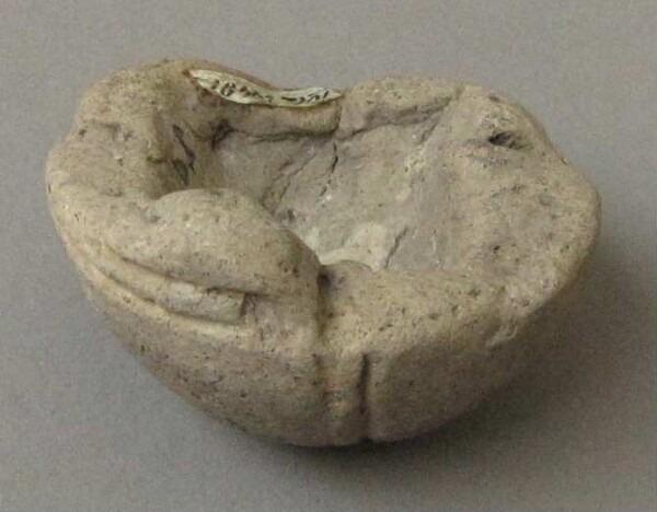 Half of a clay rattle (fragment)