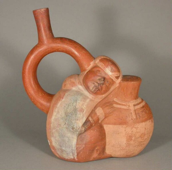 Figure vessel with stirrup spout