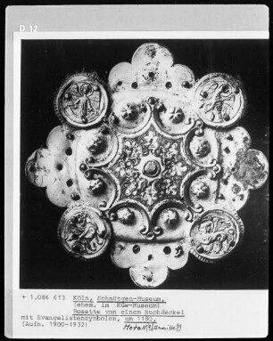 Rosette von einem Buchdeckel mit Evangelistensymbolen