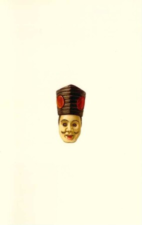 [Tafel 53. 322. Sambaso-Maske, Tänzer. Augen und Zunge beweglich. Gefärbtes Elfenbein. (Siehe S. 462.)]