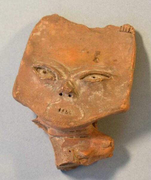 Clay fragment of a human head