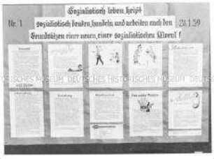 Sozialistische Leitsätze auf der Wandzeitung des VEB Feinspinnerei Erzgebirge Venusberg