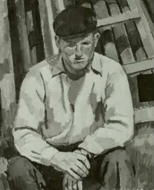 Junger Bauarbeiter mit roter Mütze